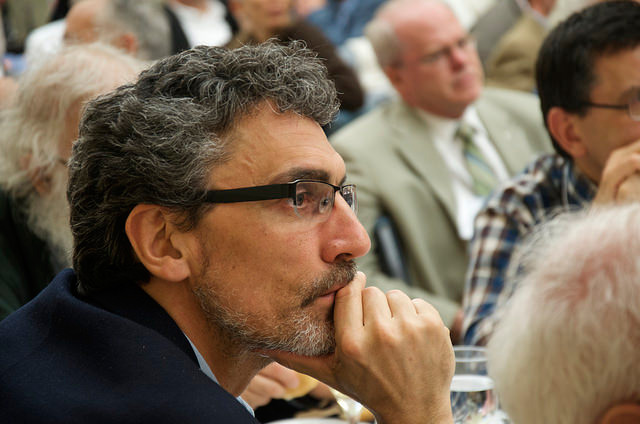 Claudio Monge listens intently during the conference.